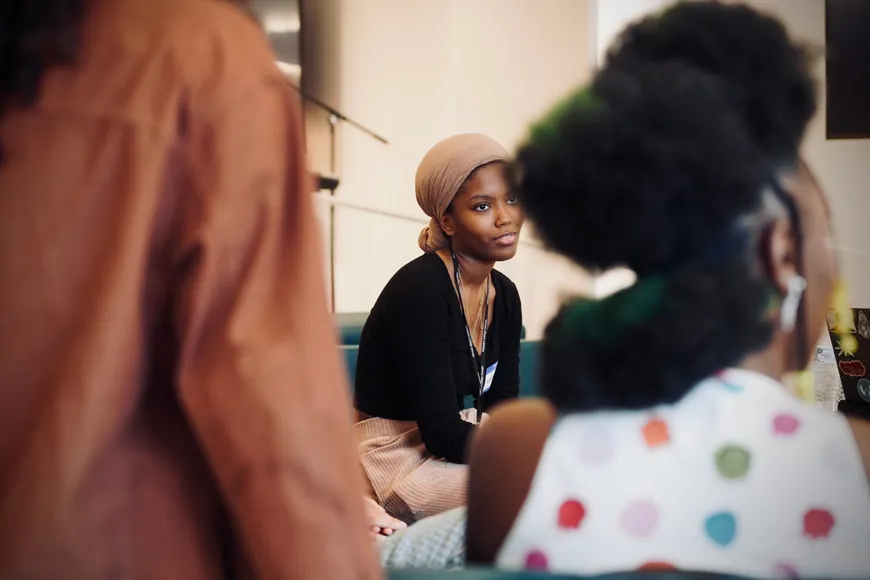 Attendee listening during a Braid community event